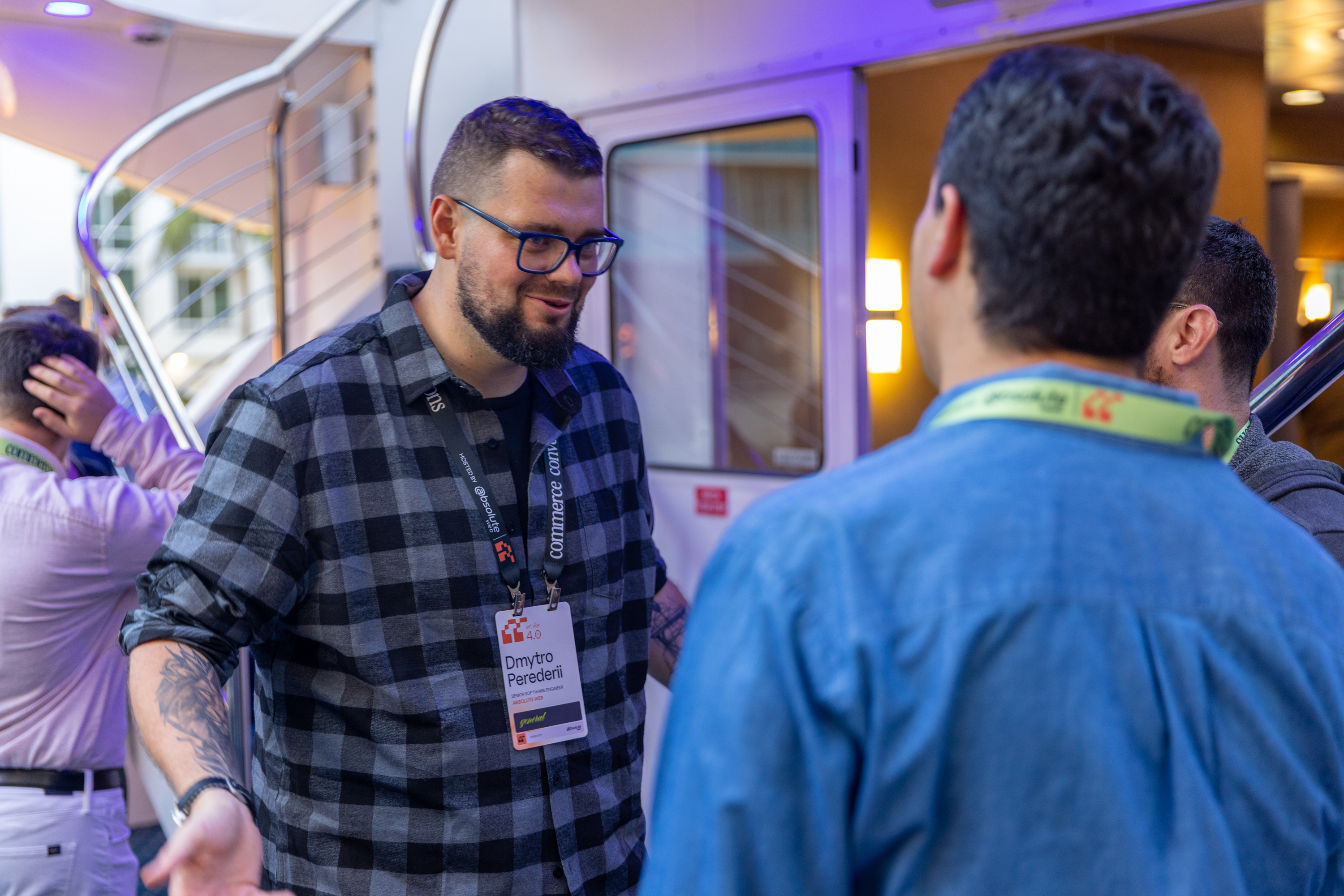 Dmytro talking with attendees at Commerce Conversations at Sea